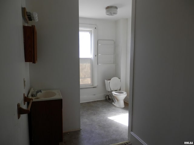 bathroom with toilet and vanity