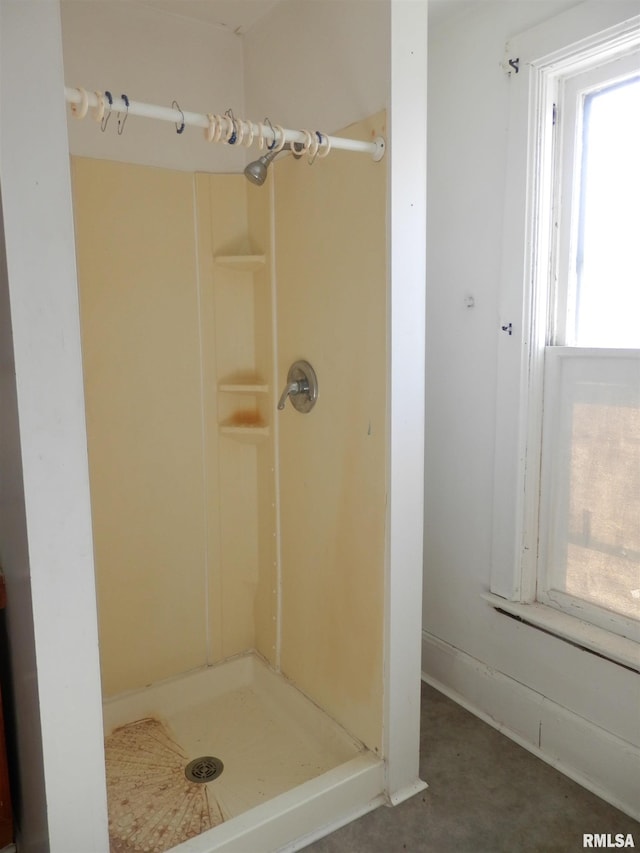 bathroom featuring a shower stall