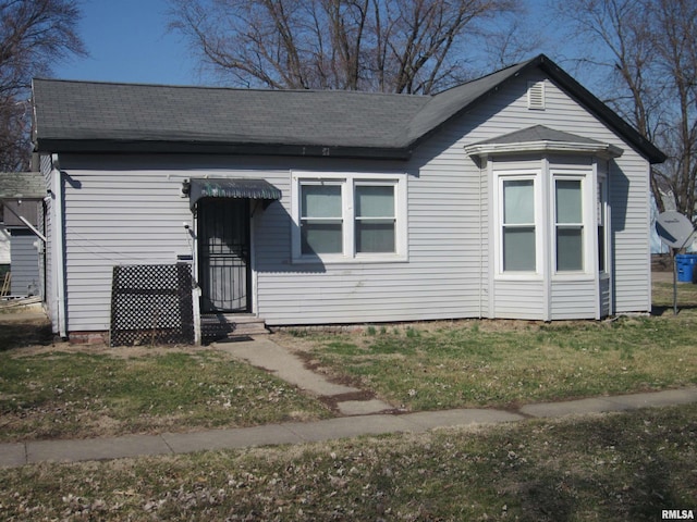 view of front of house featuring roof with shingles