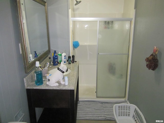 full bath with vanity and a stall shower