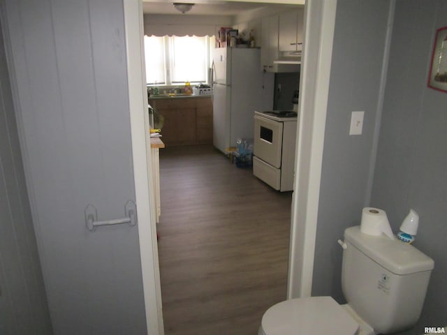 bathroom featuring toilet and wood finished floors