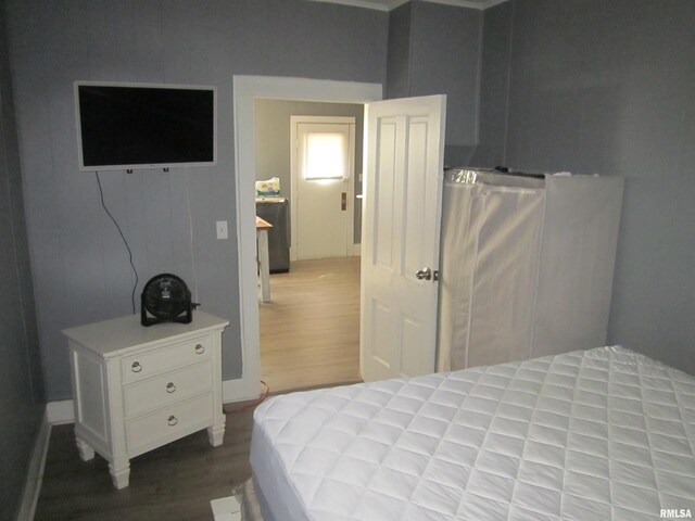 bedroom featuring wood finished floors