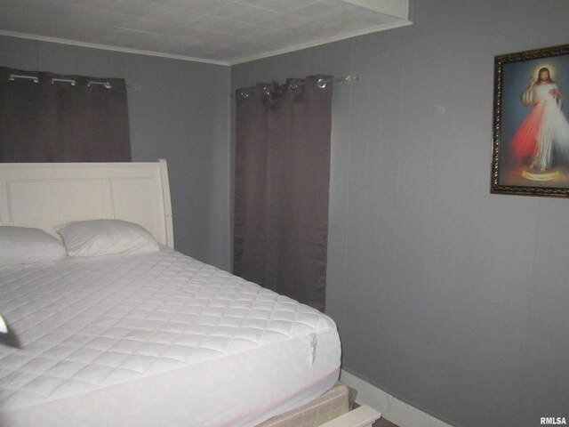 bedroom featuring crown molding