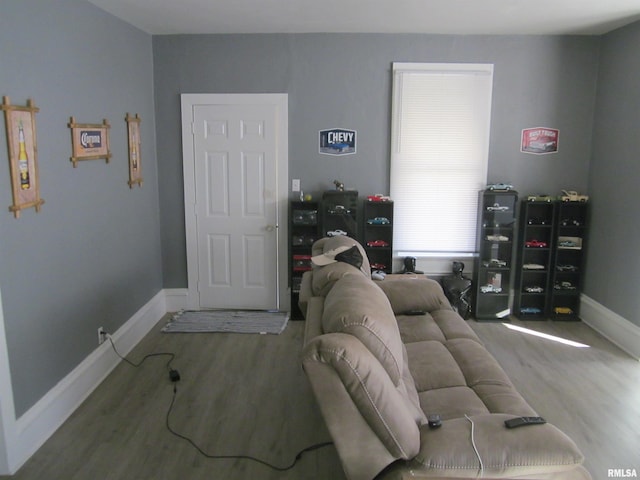 living room featuring wood finished floors and baseboards