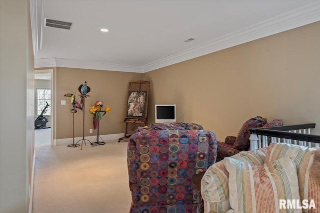 sitting room with carpet flooring, baseboards, visible vents, and ornamental molding