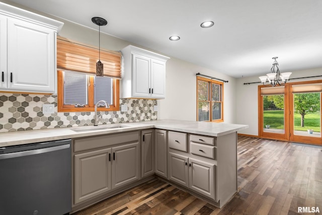 421 Turtle Dove Dr, Sherman, IL 62684 - kitchen with tasteful backsplash, stainless steel dishwasher, a sink, dark wood-style flooring, and a peninsula