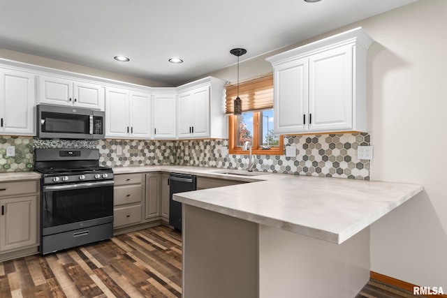 421 Turtle Dove Dr, Sherman, IL 62684 - kitchen with decorative light fixtures, appliances with stainless steel finishes, light countertops, a sink, and a peninsula