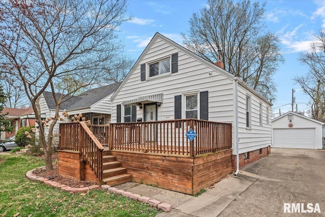 back of property with an outdoor structure, a wooden deck, a garage, and a chimney