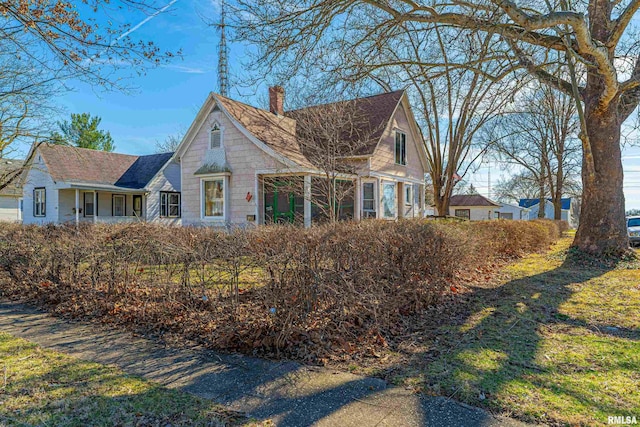 view of home's exterior with a chimney