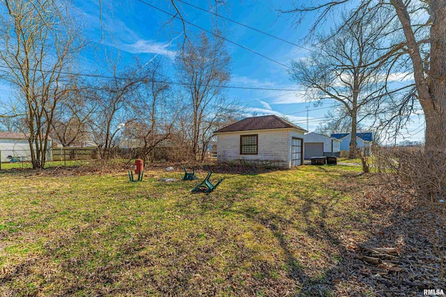 view of yard with an outbuilding and fence