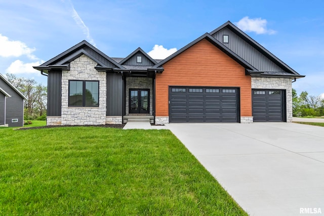 5819 Kelley Pointe Dr, Springfield, IL 62711 - view of front facade featuring an attached garage, stone siding, board and batten siding, french doors, and driveway
