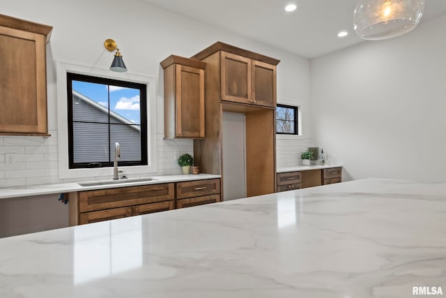 5819 Kelley Pointe Dr, Springfield, IL 62711 - kitchen featuring a kitchen island, recessed lighting, light countertops, and tasteful backsplash