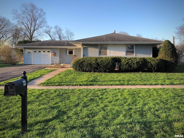 132 W Coal St, Wataga, IL 61488 - ranch-style house with a front lawn, a garage, and driveway