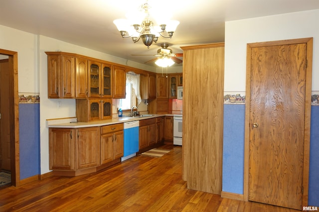 132 W Coal St, Wataga, IL 61488 - kitchen with glass insert cabinets, light countertops, wood finished floors, brown cabinetry, and white appliances