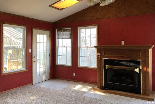 132 W Coal St, Wataga, IL 61488 - unfurnished living room featuring baseboards, carpet floors, a fireplace, and vaulted ceiling