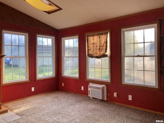 132 W Coal St, Wataga, IL 61488 - carpeted empty room featuring baseboards, an AC wall unit, and lofted ceiling