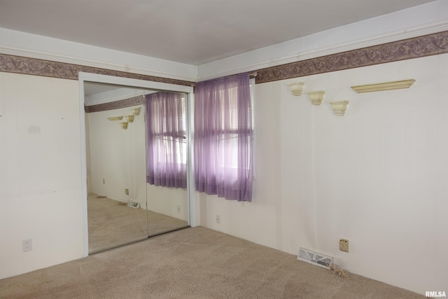 132 W Coal St, Wataga, IL 61488 - carpeted spare room featuring visible vents