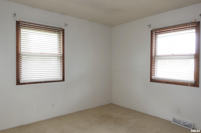 132 W Coal St, Wataga, IL 61488 - carpeted empty room with visible vents