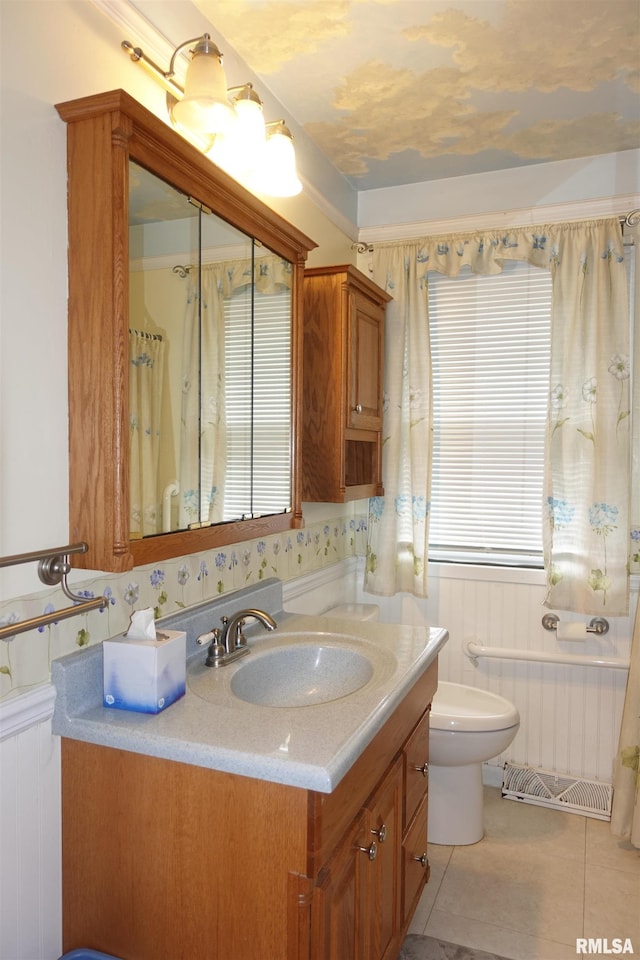 132 W Coal St, Wataga, IL 61488 - bathroom featuring tile patterned flooring, toilet, radiator, and vanity