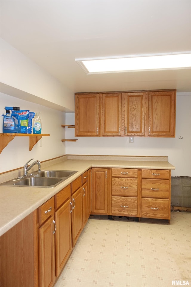 132 W Coal St, Wataga, IL 61488 - kitchen with a sink, light floors, light countertops, brown cabinetry, and open shelves