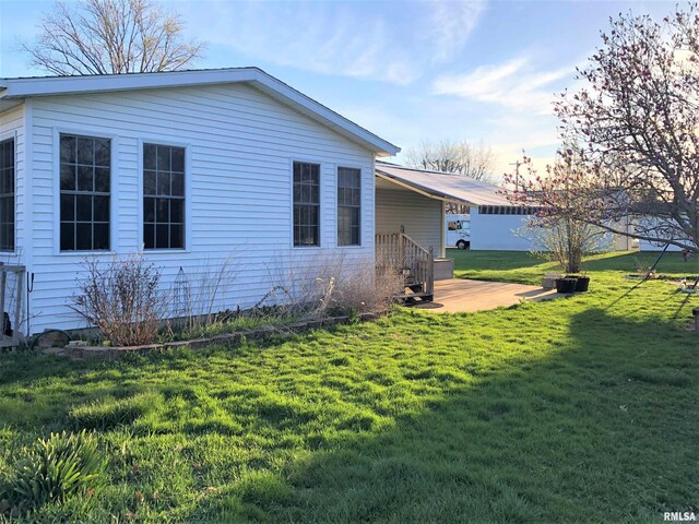 132 W Coal St, Wataga, IL 61488 - view of home's exterior with a yard