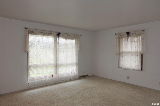 132 W Coal St, Wataga, IL 61488 - empty room featuring a wealth of natural light, visible vents, and carpet floors