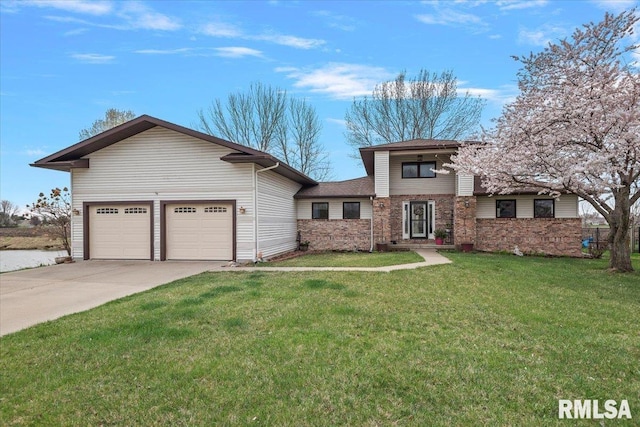 view of front of house with a front lawn, an attached garage, and concrete driveway