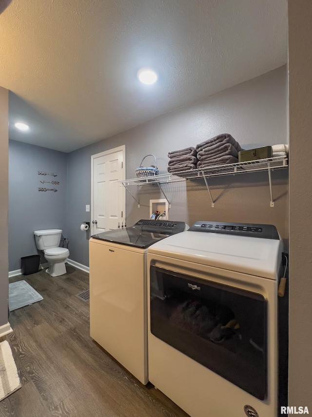 253 Day St, Galesburg, IL 61401 - washroom with a textured ceiling, dark wood finished floors, separate washer and dryer, baseboards, and laundry area