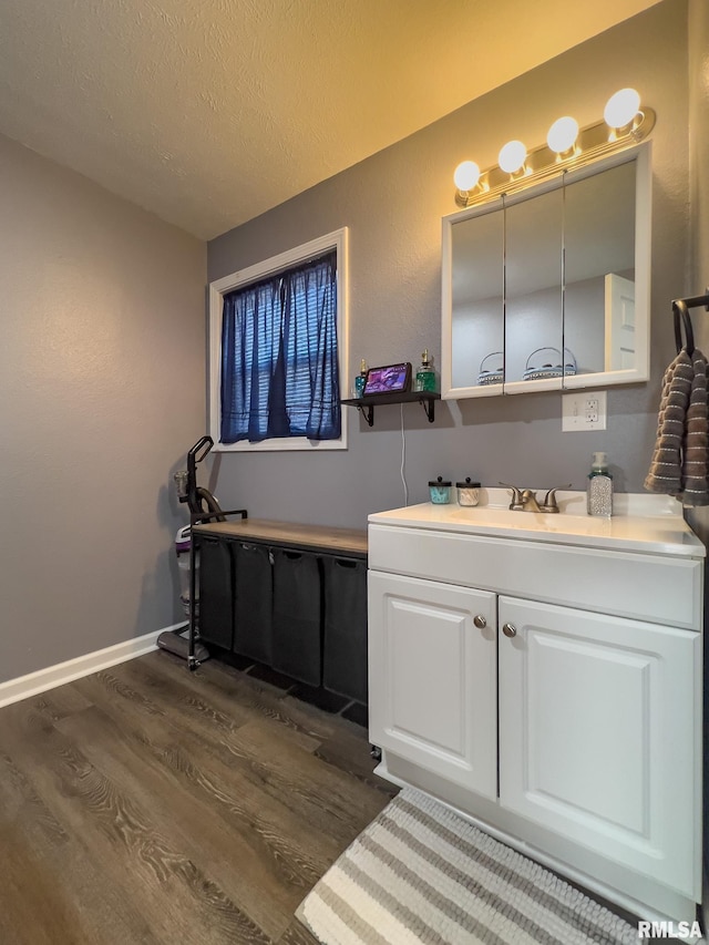 253 Day St, Galesburg, IL 61401 - bathroom with a textured ceiling, vanity, baseboards, and wood finished floors