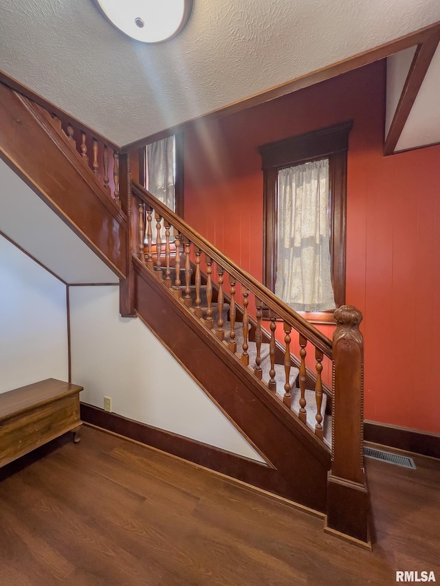 253 Day St, Galesburg, IL 61401 - stairs featuring baseboards, wood finished floors, visible vents, and a textured ceiling