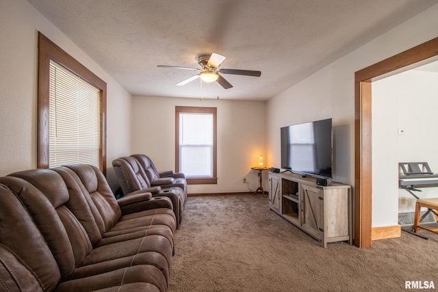 253 Day St, Galesburg, IL 61401 - living room with light carpet, baseboards, and a ceiling fan