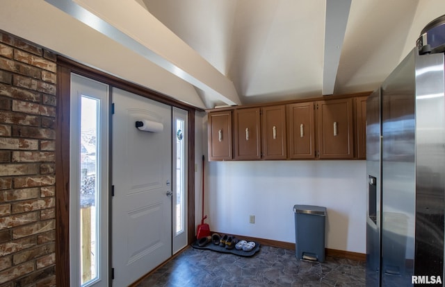 253 Day St, Galesburg, IL 61401 - foyer with stone finish flooring, baseboards, and brick wall