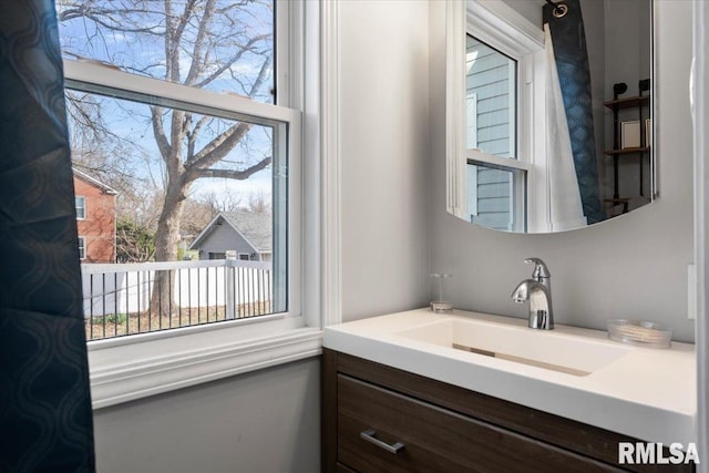 bathroom with a healthy amount of sunlight and vanity