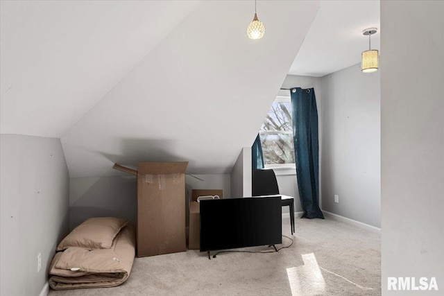 additional living space with carpet, baseboards, and vaulted ceiling