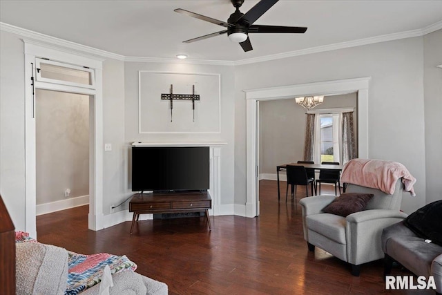 living area featuring baseboards, crown molding, and wood finished floors