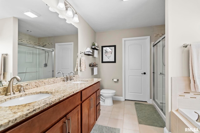 full bath featuring a stall shower, double vanity, and a sink