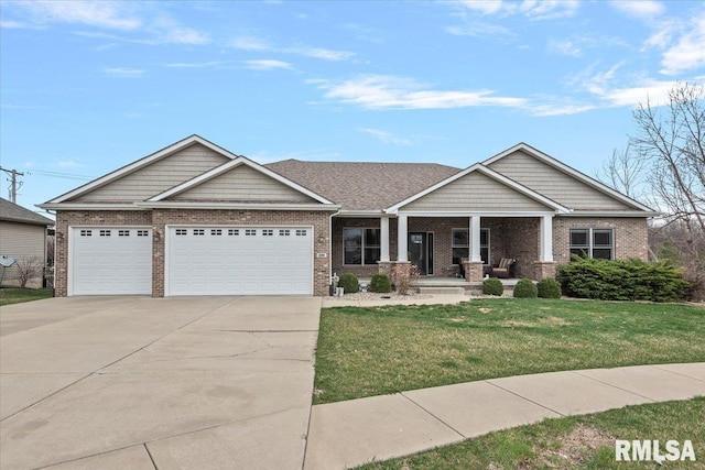 craftsman inspired home featuring a garage, covered porch, a front yard, brick siding, and concrete driveway