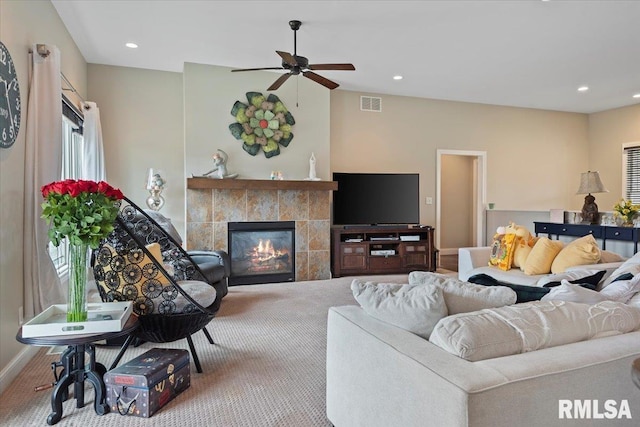 living area with baseboards, recessed lighting, a fireplace, visible vents, and ceiling fan