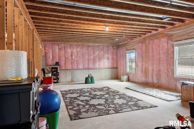 interior space featuring concrete floors and a healthy amount of sunlight