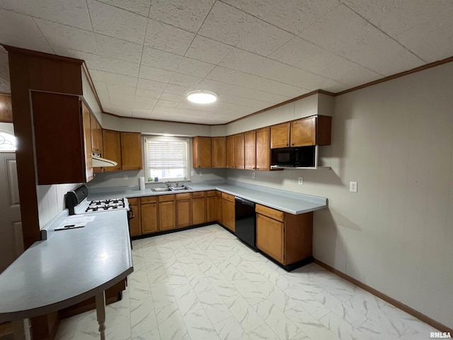 kitchen with brown cabinetry, marble finish floor, a sink, and black appliances