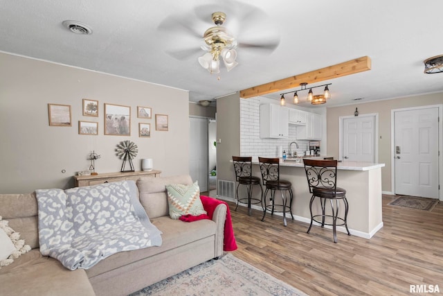 2364 E Keys Ave, Springfield, IL 62702 - living room with ceiling fan, light wood-type flooring, and baseboards