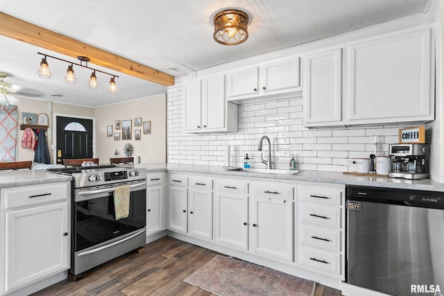 2364 E Keys Ave, Springfield, IL 62702 - kitchen featuring appliances with stainless steel finishes, a sink, a peninsula, white cabinetry, and tasteful backsplash