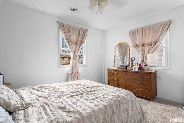 2364 E Keys Ave, Springfield, IL 62702 - bedroom with light colored carpet, multiple windows, and a ceiling fan