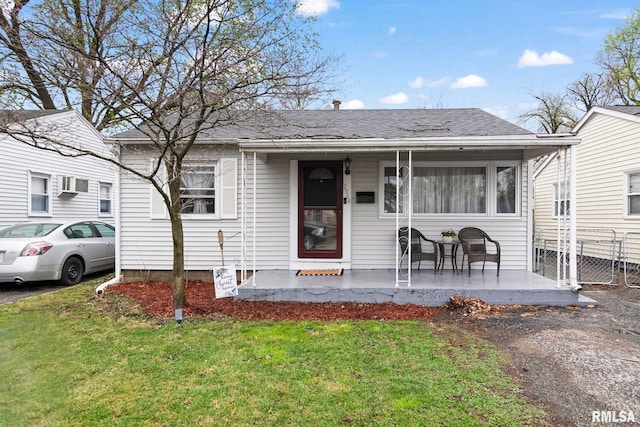 2364 E Keys Ave, Springfield, IL 62702 - view of front facade featuring an AC wall unit and a shingled roof