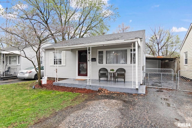 2364 E Keys Ave, Springfield, IL 62702 - view of front facade featuring a front yard, asphalt driveway, and roof with shingles