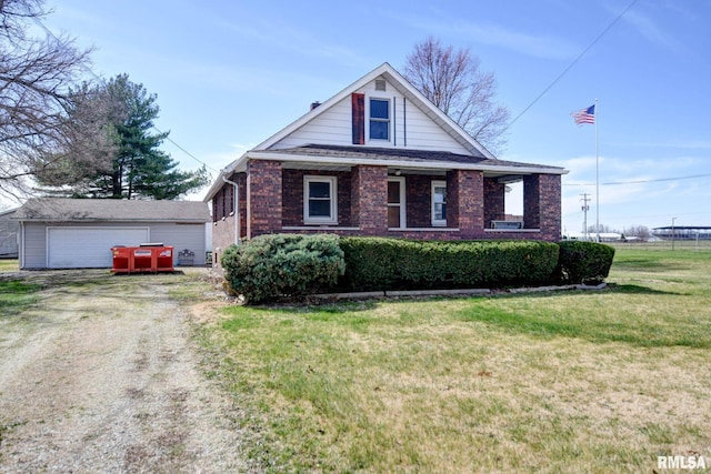view of front of house featuring a garage, brick siding, and a front yard