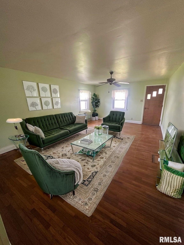 living area with ceiling fan, wood finished floors, and baseboards