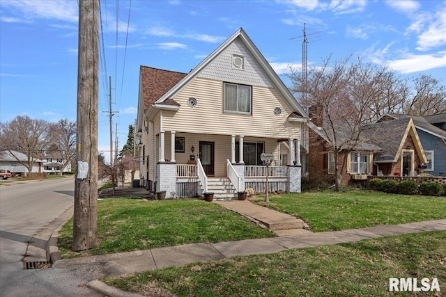 view of front of home featuring a porch and a front lawn