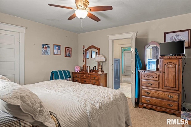 carpeted bedroom with a ceiling fan