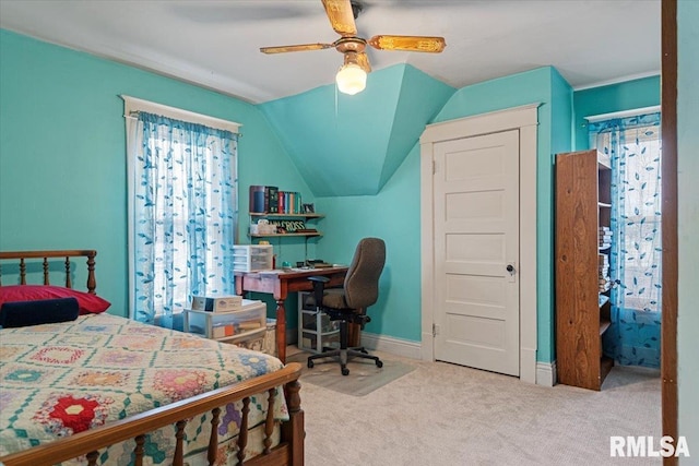 bedroom with baseboards, carpet flooring, lofted ceiling, and ceiling fan